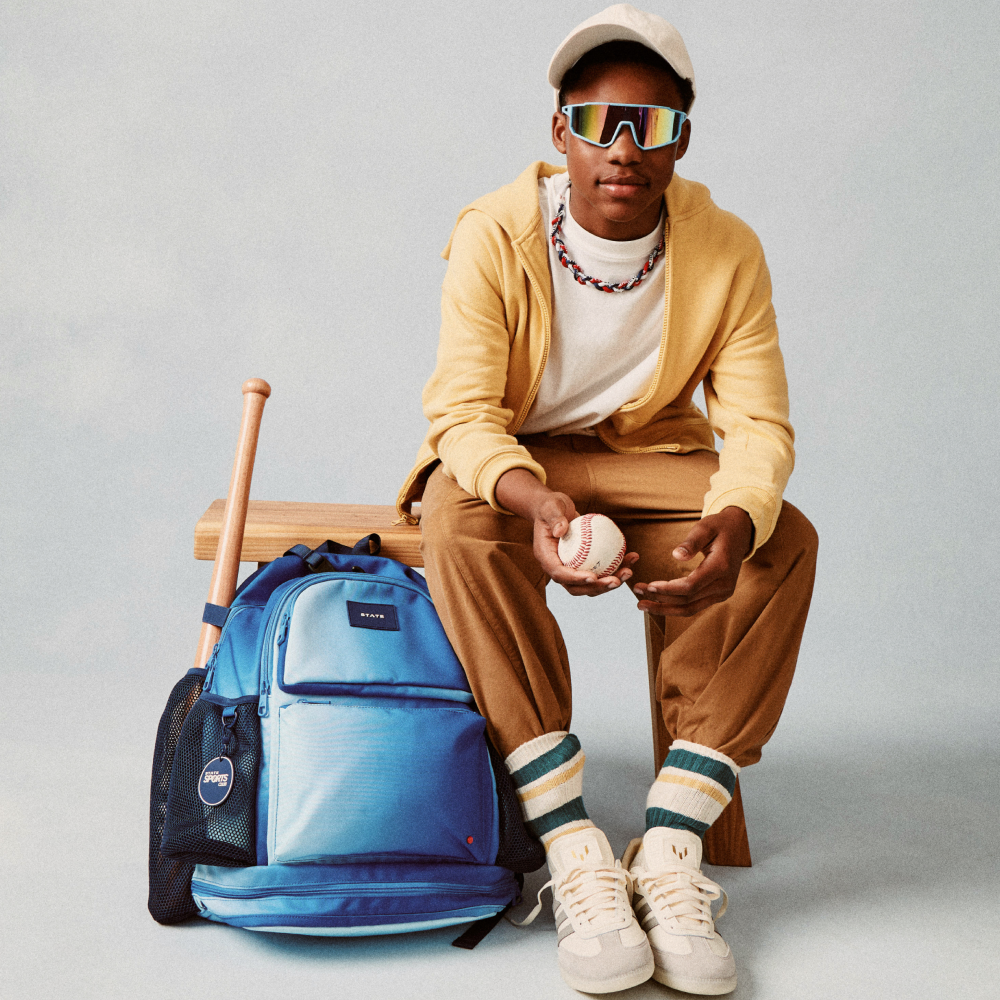 Boy sitting with STATE Bags Shea Backpack Blue Gradient