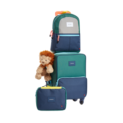 Product image of STATE Bags travel set in green/navy including, mini Logan suitcase, bensen toiletry bag, and Kane Kids mini Travel backpack