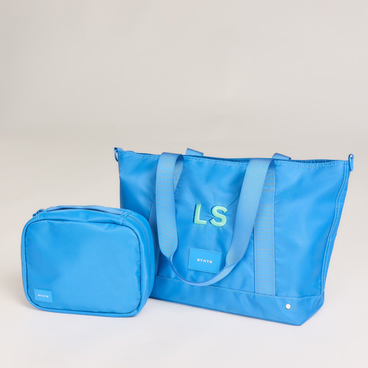 state bags graham tote blue and bensen toiletry kit blue
