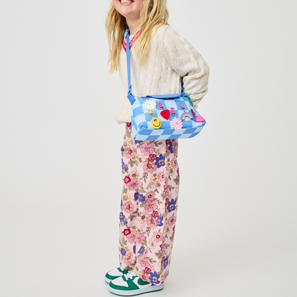 Girl wearing STATE Bags Chelsea Pouchette Charms Blue Check