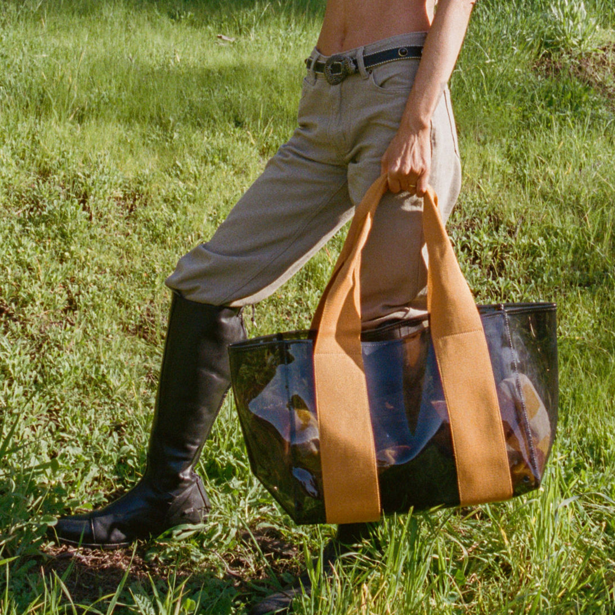 Woman holding state bags Wellington cabana tote TPU black