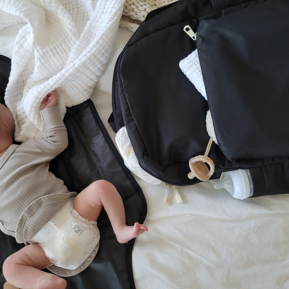 baby next to state bags lorimer diaper bag backpack