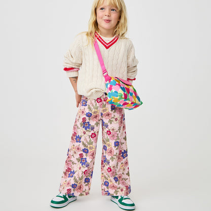 Girl wearing STATE Bags Chelsea Pouchette Happy Fuzzy Hearts