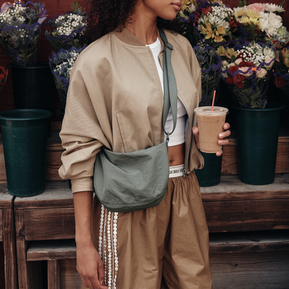 Woman wearing STATE Bags Luna Mini Crossbody Olive
