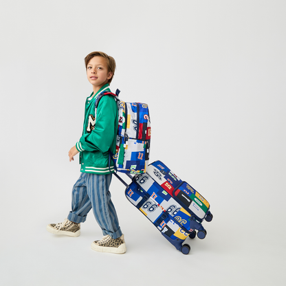 boy holding STATE Bags Logan Carry-On Suitcase Varisty Numbers